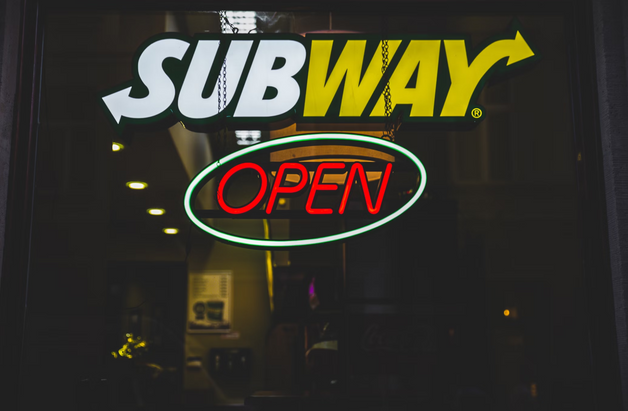 Subway with 'OPEN' signage